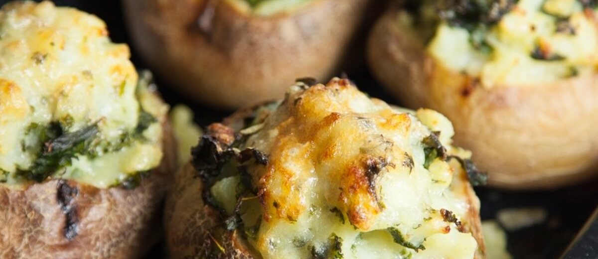 Baked potatoes with cheesy kale filling recipe / Riverford