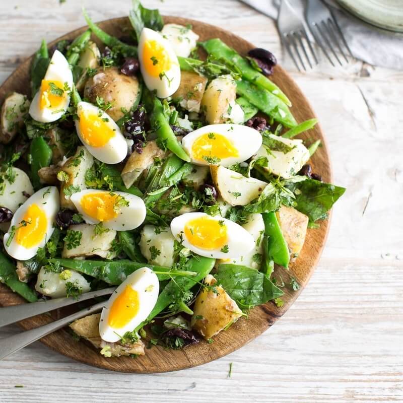 Green bean & potato salad with eggs, green herbs & olives / Riverford