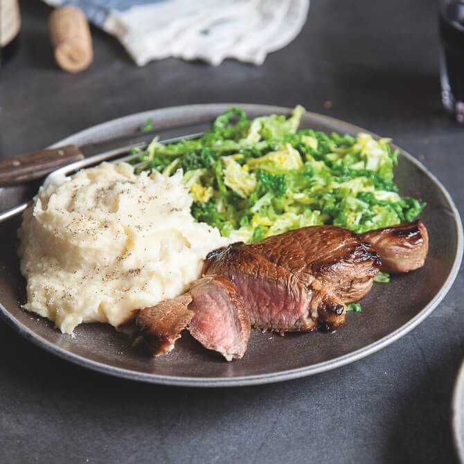 Lamb leg steak with parsnip and almond mash and cabbage / Riverford