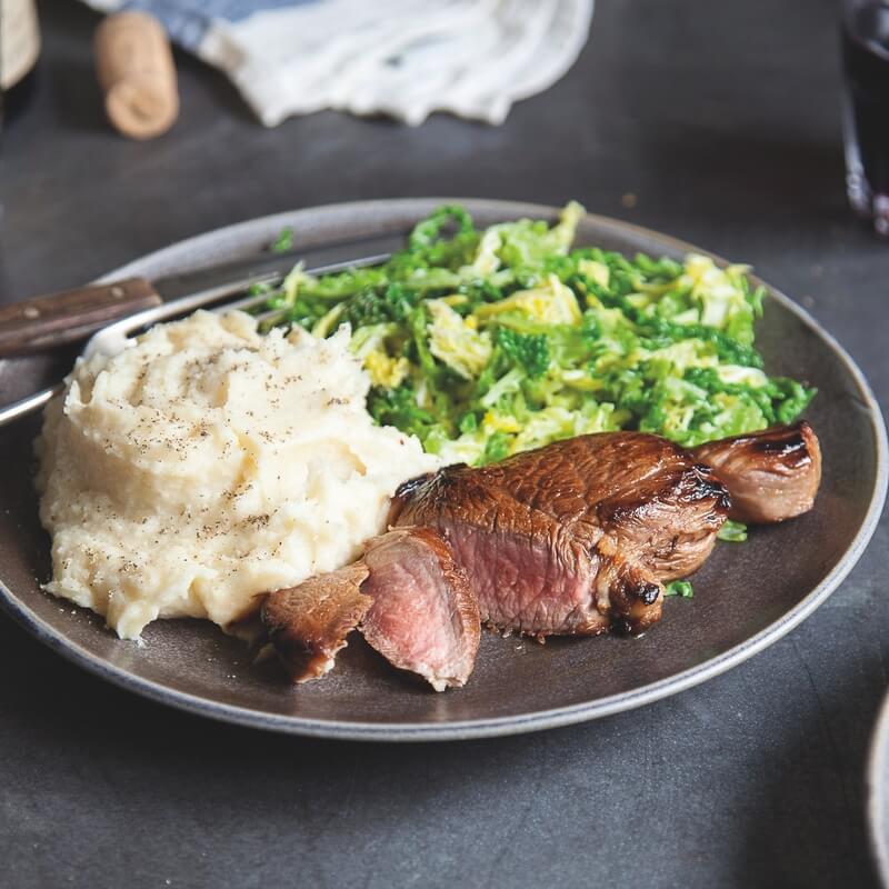 Lamb leg steak with parsnip and almond mash and cabbage / Riverford