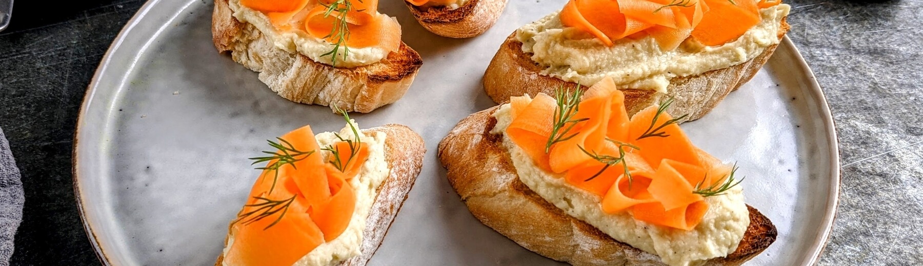 Parsnip & white bean hummus pincho with pickled carrot / Riverford
