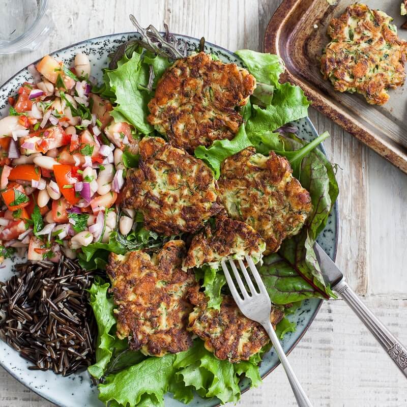 Courgette & feta fritters with tomato & bean salsa recipe / Riverford