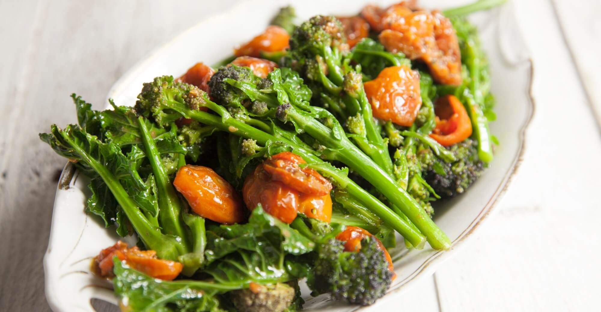 Purple sprouting broccoli with roast tomato and anchovy sa... / Riverford