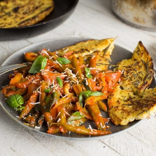 Ragú of green beans with tomatoes, olives and farinata / Riverford