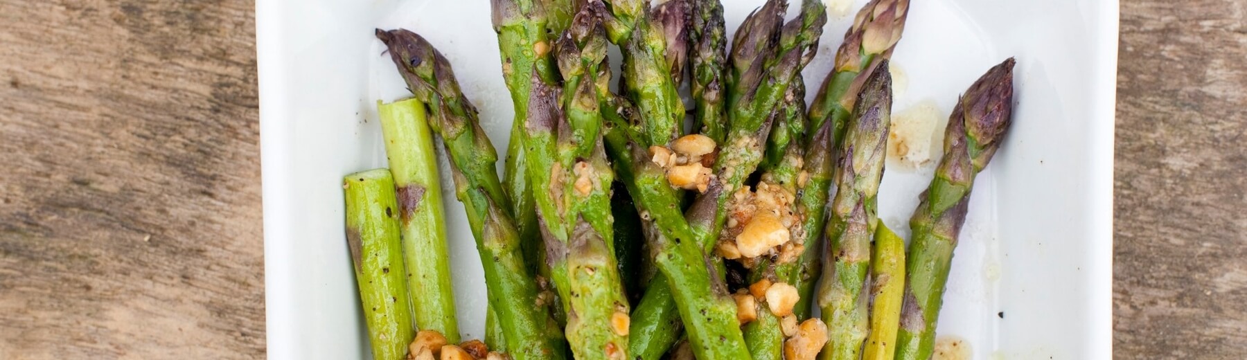 Roasted asparagus with hazelnut dressing recipe / Riverford