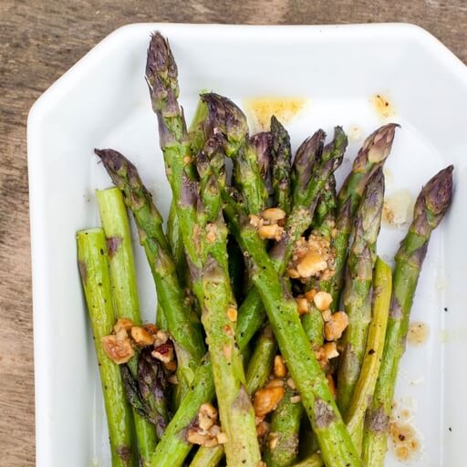 Roasted asparagus with hazelnut dressing recipe / Riverford