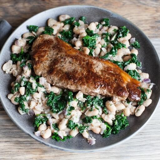 Sirloin steak with spinach, garlic and rosemary smashed be... / Riverford