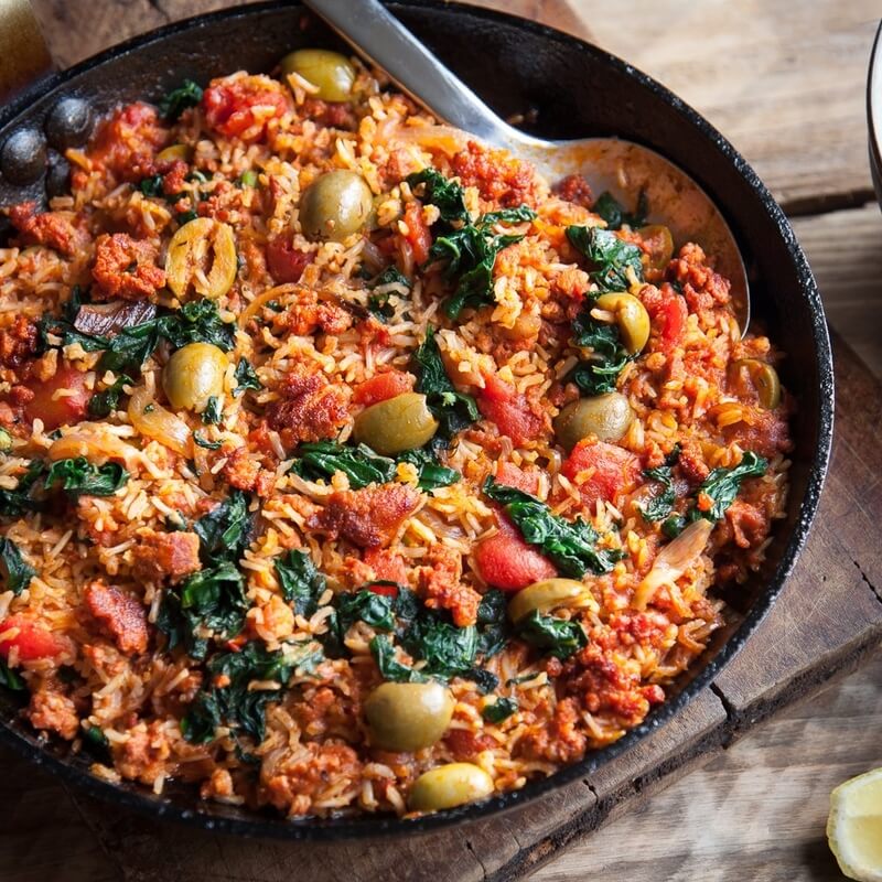 Tomato & chorizo rice with green olives & spinach recipe / Riverford