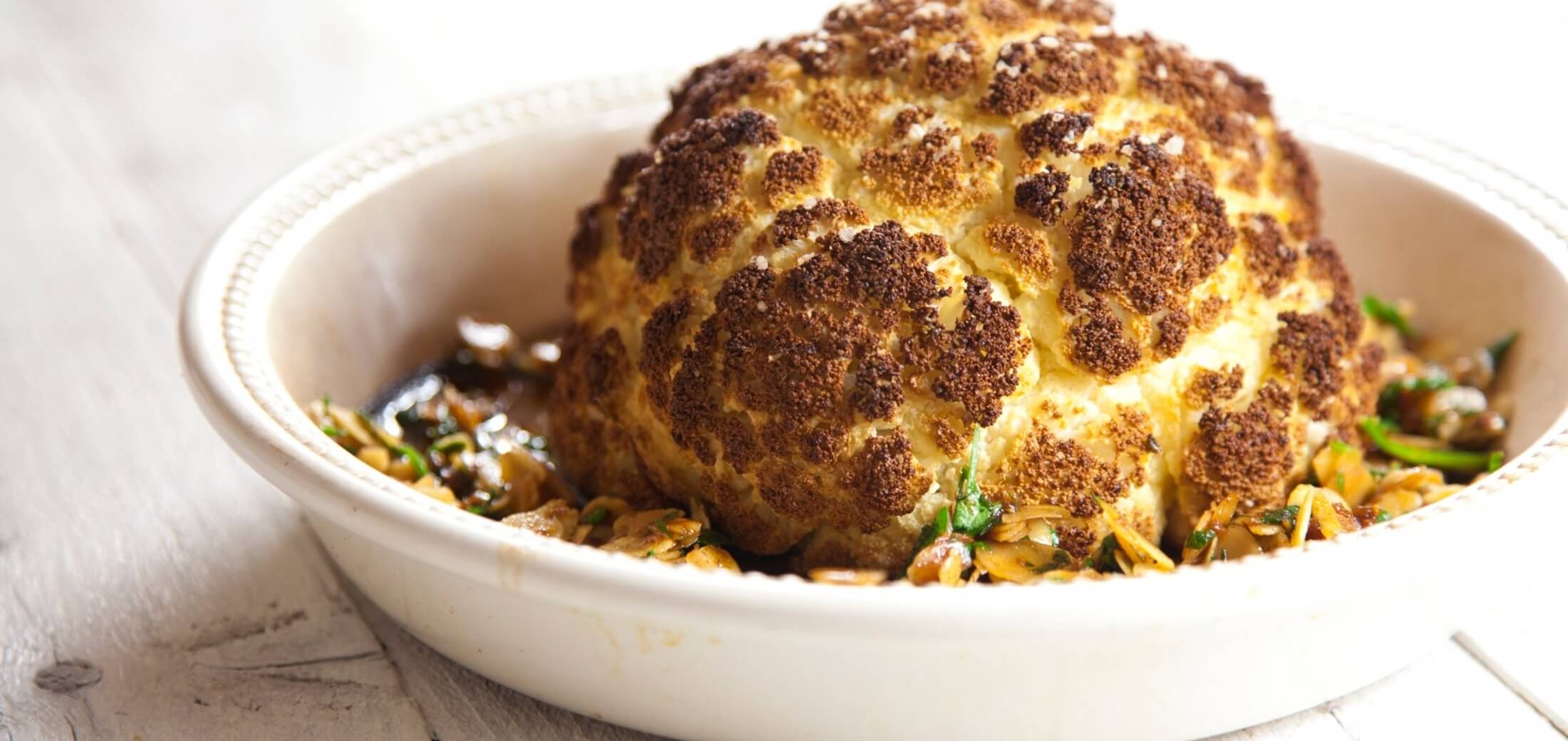 Whole roasted cauliflower with almonds and garlic recipe / Riverford